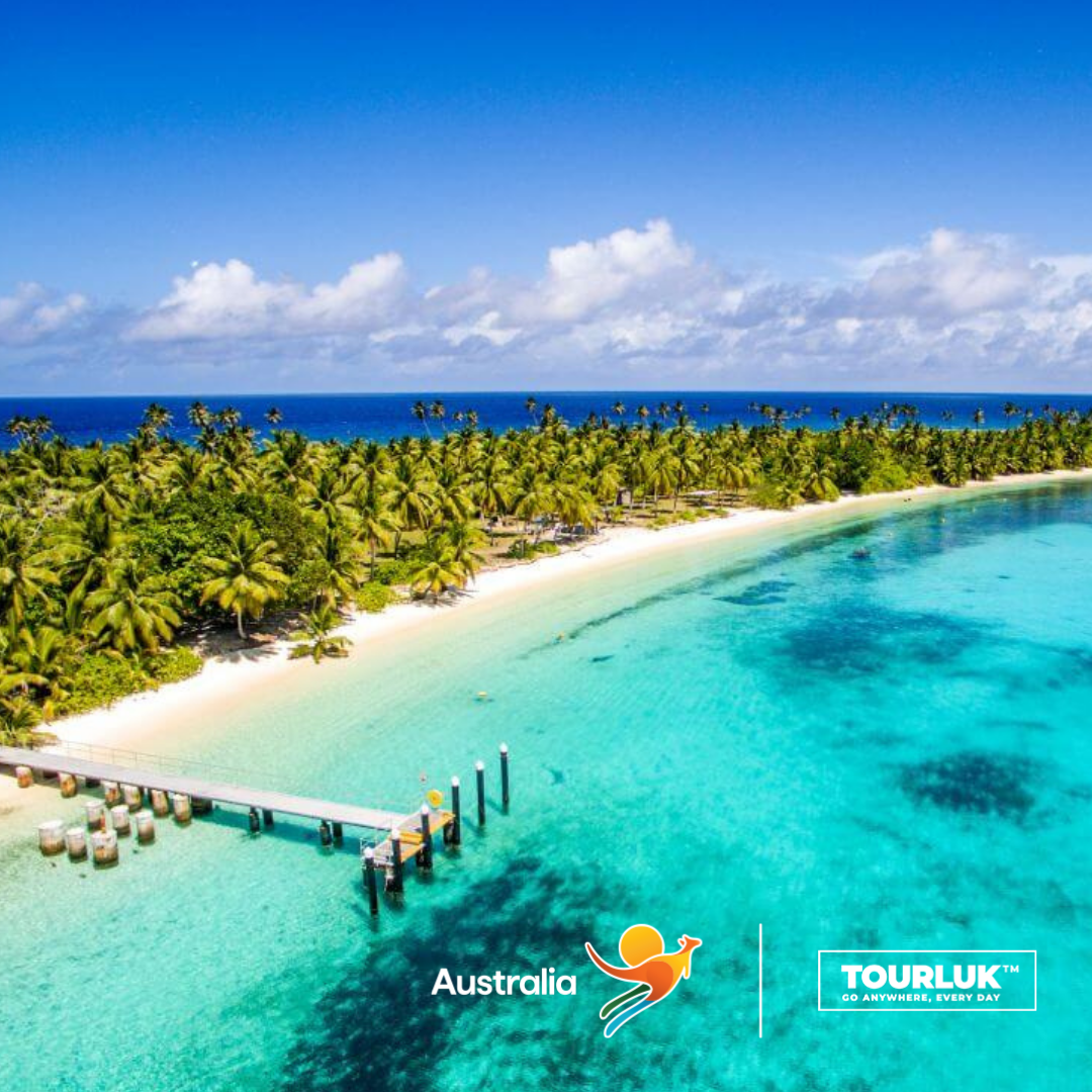 Toàn cảnh Cocos (Keeling) Islands, Australia với bãi cát trắng mịn, hàng dừa xanh trải dài và làn nước biển xanh ngọc trong vắt, tạo nên một thiên đường nhiệt đới hoang sơ lý tưởng cho nghỉ dưỡng và snorkeling. 