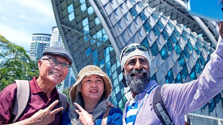 International travelers enjoying authentic local travel experiences through Tourluk