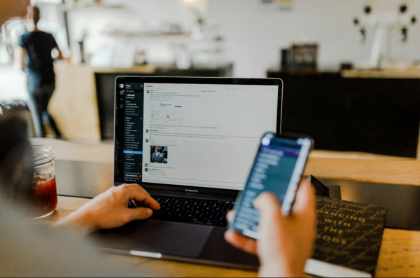 A user accessing data on a laptop and mobile device, representing the legal basis for processing personal data including contractual necessity and legal obligations as detailed in Privacy Policy tourluk.jpg.